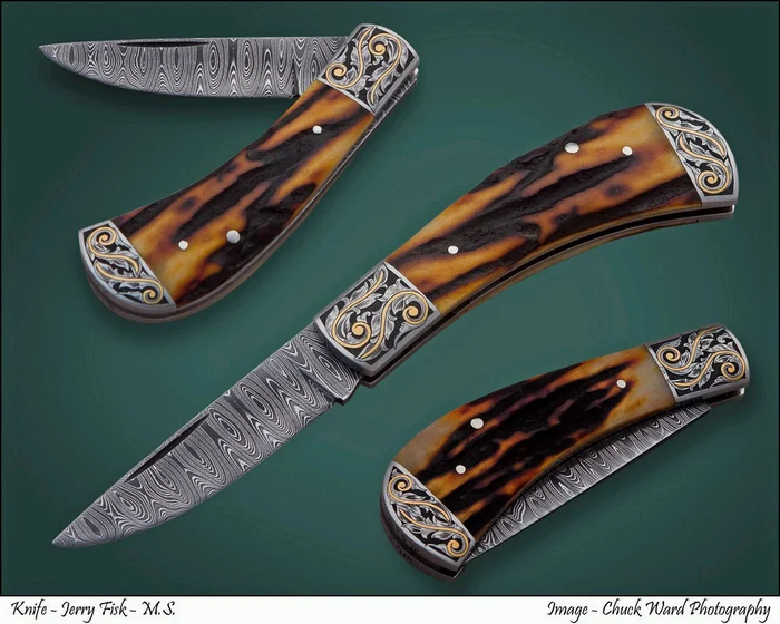 Three folding knives with jigged bone handles and engraved bolsters on a dark green ground.